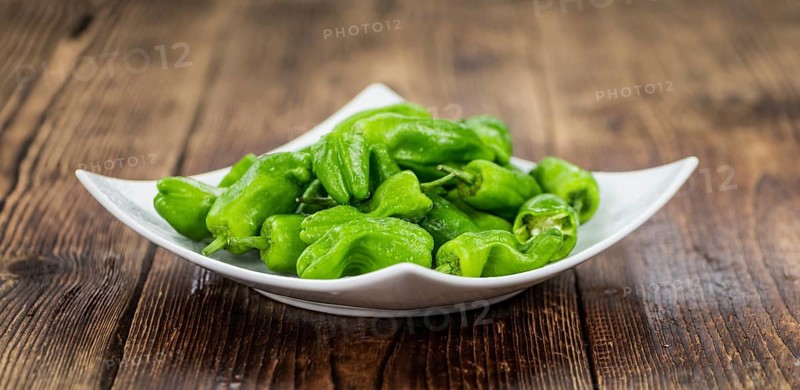 Portion of fresh Raw Pimientos close-up shot, selective focus