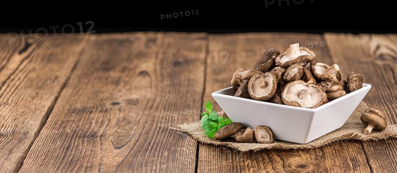 Portion of fresh Shiitake mushrooms close-up shot, selective focus