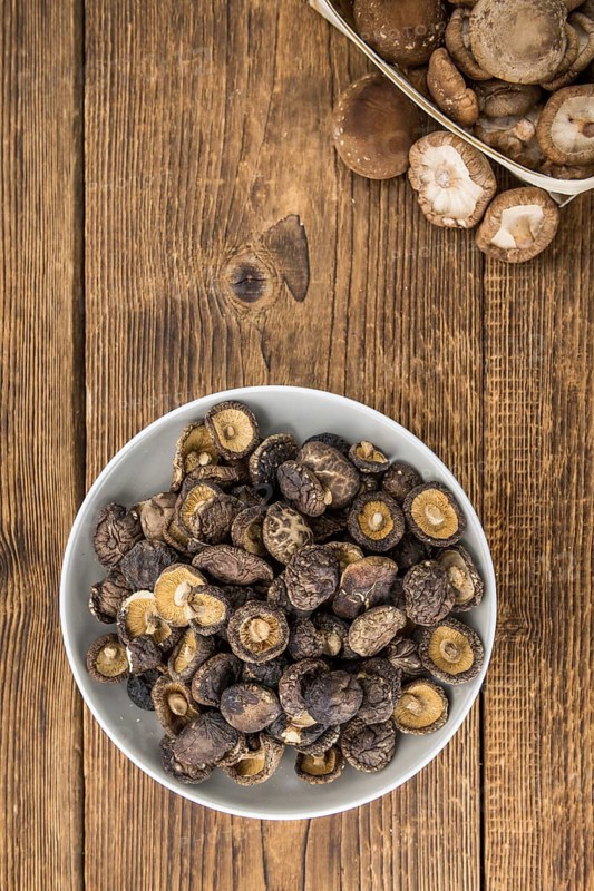 Dried Shiitake on a vintage background as detailed close-up shot, selective focus