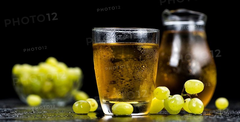 Some healthy Grape Juice (selective focus, close-up shot)