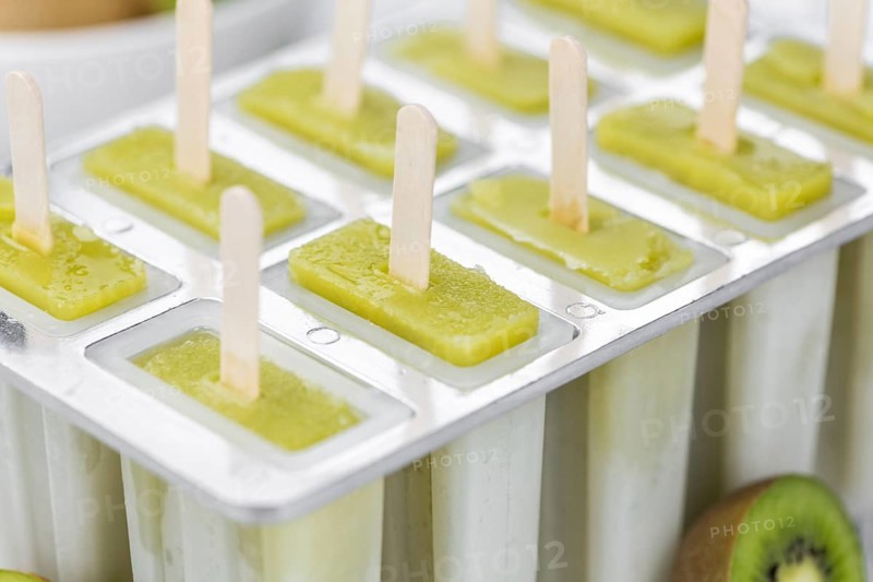 Kiwi Popsicles (fresh) as detailed close-up shot, selective focus)