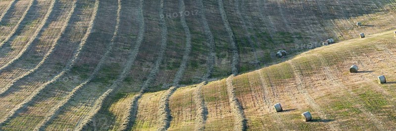 Harvested wheat field with bales of straw, landscape around Pienza, Val d'Orcia, Orcia Valley, UNESCO World Heritage Site, Province of Siena, Tuscany, Italy, Europe