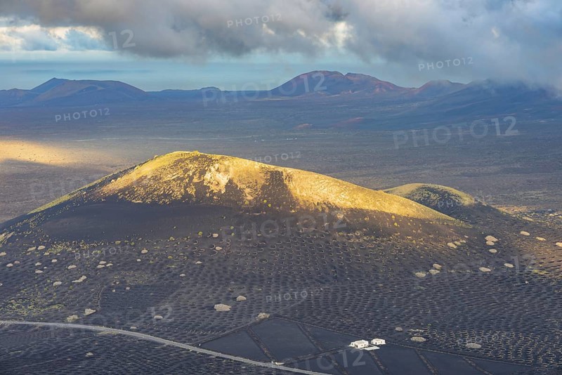 Panorama from Montana de Guardilama to Montana Chupaderos and the wine-growing region of La Geria, with the Fire Mountains behind, Lanzarote, Canary Islands, Spain, Europe