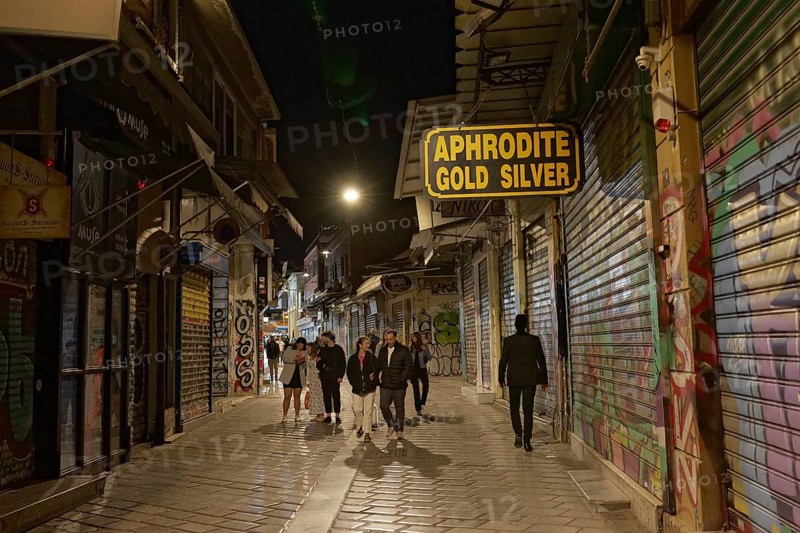 Strollers in an alley at night, closed shops, Monastiraki flea market, Athens, Greece, Europe
