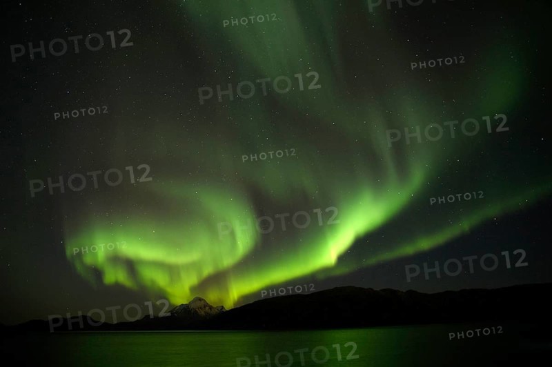 Auroras during new Moon in the bay near Gronnedal (Kangilinnguit), Southwest Greenland in Autumn