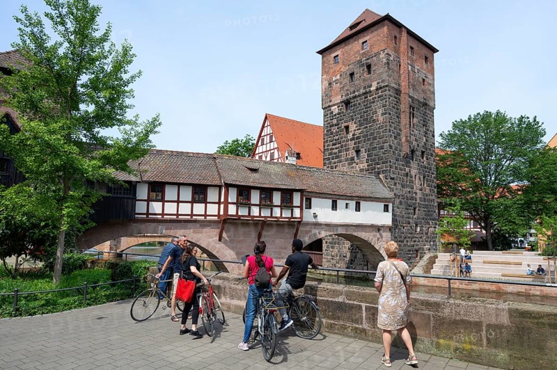 Tourists in front of the Henkersteg with water tower on the Pegnitz Nuremberg, Middle Franconia, Bavaria, Germany, Europe