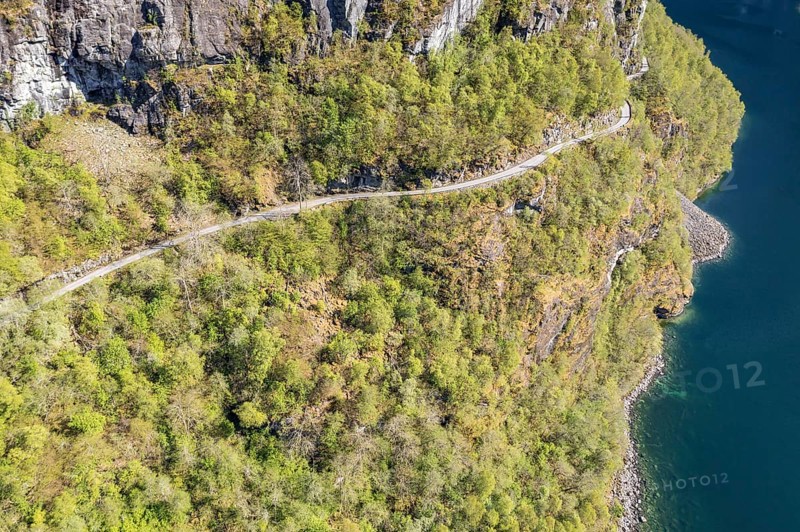 Aerial view of lake Lovatnet (or: Loenvatnet), gravel mountain road to Kjenndalstova, valley Lodalen south of village Loen, Norway, Europe