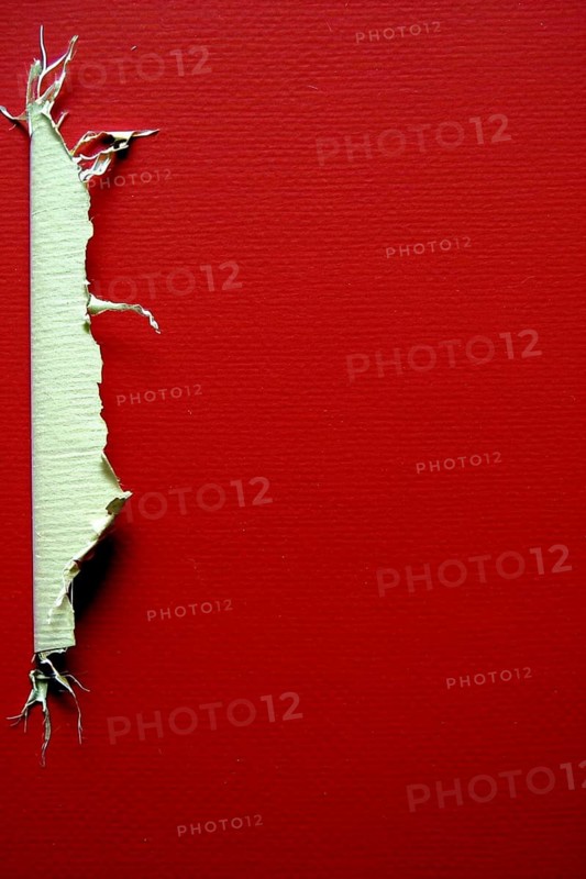 A strip of torn paper against a vibrant red background, highlighting contrast and texture, AI generated