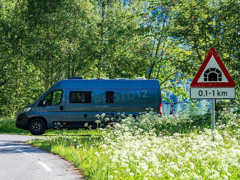 Camper van parked at the Sognefjord, road tunnel sign, Norway, Europe