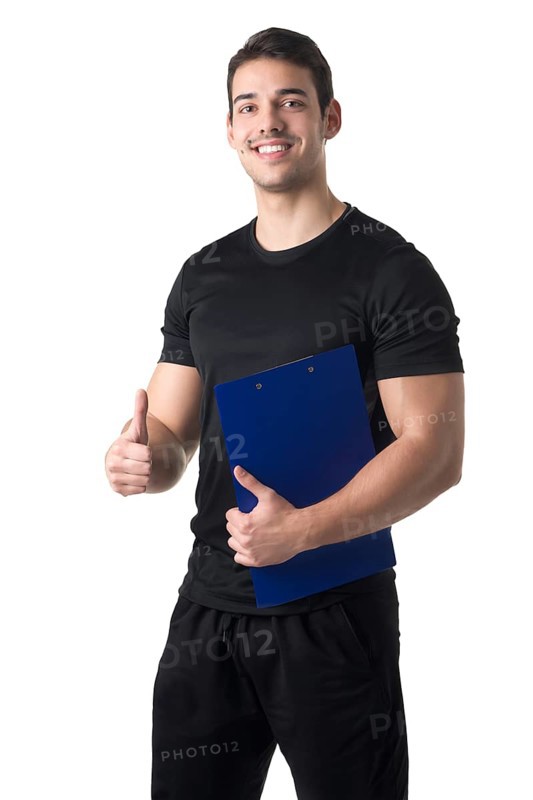 Personal trainer in a gym holding a notepad isolated in white