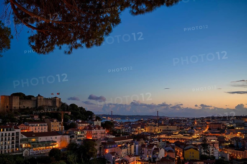 View from the viewpoint Miradouro da Graça, also Sophia de Mello Breyner Andresen, city view, old town, bridge 25 de Abril, river Tejo, Lisbon, evening mood, twilight, blue hour, Portugal, Europe