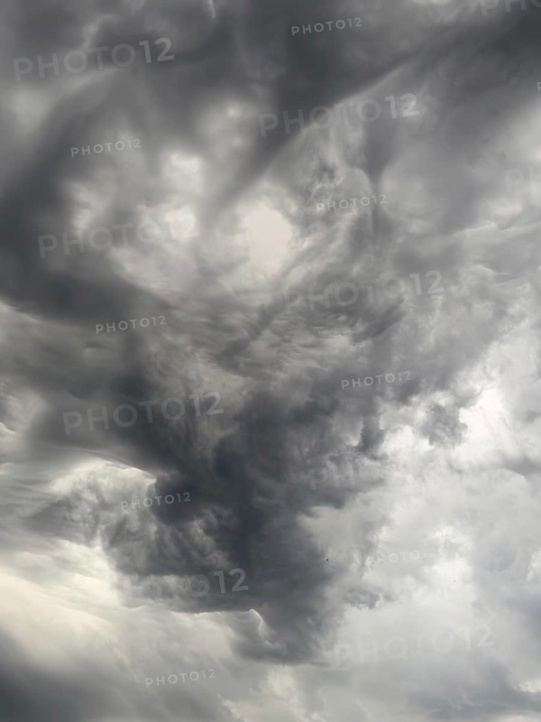 Cloud formation after storm warning thunderstorm warning grey dark clouds shortly in front of thunderstorm swirled by storm torn clouds thunderclouds, North Rhine-Westphalia, Germany, Europe