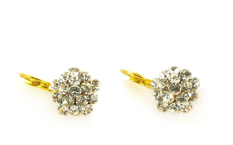 Diamond earrings on yellow gold, isolated towards white background