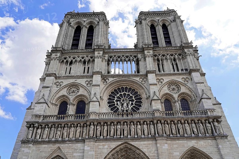 Notre Dame de Paris Cathedral, west façade, Île de la Cité, Paris, France, Europe, Gothic cathedral with striking towers and a large rose window against a blue sky, Europe