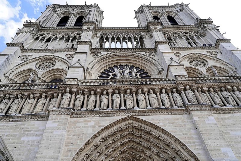 Cathedral Notre Dame de Paris, west facade, Île de la Cité, Paris, France, Europe, Close-up of the detailed gothic facade of the cathedral with heavenly background, Europe