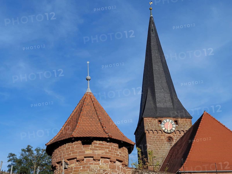 Gothic church with high tower and clock, red roof and blue sky, Kandel, Palatinate, Germany, Europe