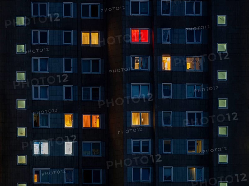 Partially illuminated room windows in a high-rise building at night, Offenbach am Main, Hesse, Germany, Europe