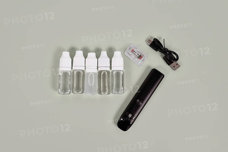 Bottles with liquid solutions for electronic cigarettes and charger