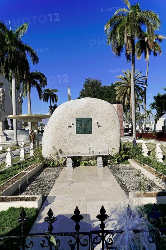 Gravesite, Fidel Castro 1926-2016, Cementerio Santa Ifigenia, Santiago de Cuba, Cuba, Central America, Large gravestone surrounded by palm trees and green areas, under a clear blue sky in a cemetery, Cuba, Central America