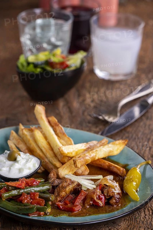Greek gyros with metaxa sauce and chips