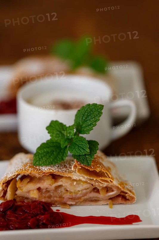 Austrian apple strudel on wood