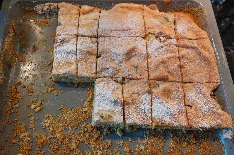 Freshly sliced covered apple pie on a baking tray, Bavaria, Germany, Europe