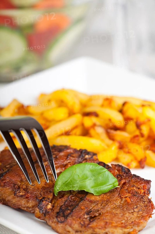 Juicy pork steak with chips