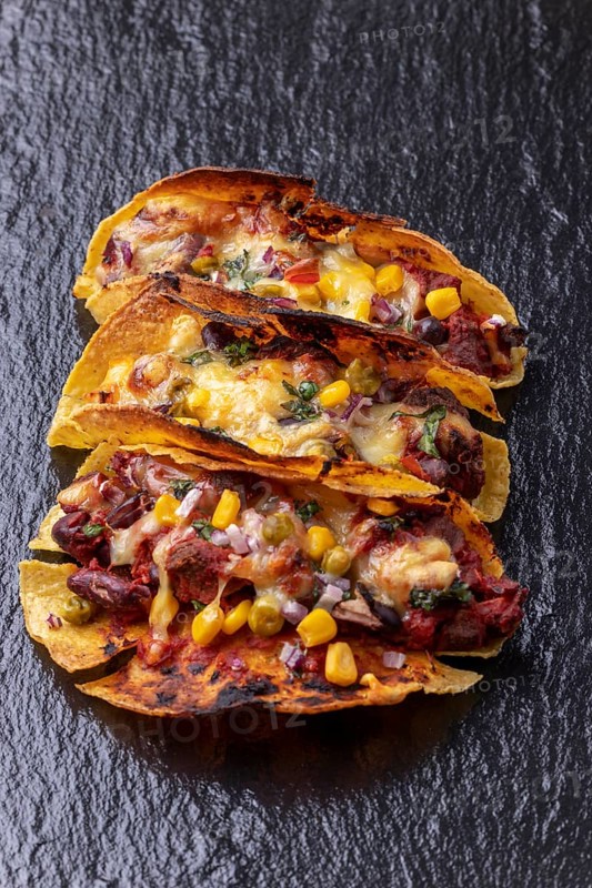 Gratinated tacos on slate