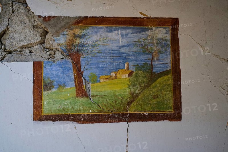 On a cracked wall of an abandoned house is a painting of a rural scene with a tree, church and green fields, Lost Place, World War II bunker, barrack, Kalavarda, Rhodes, Dodecanese, Greek Islands, Greece, Europe