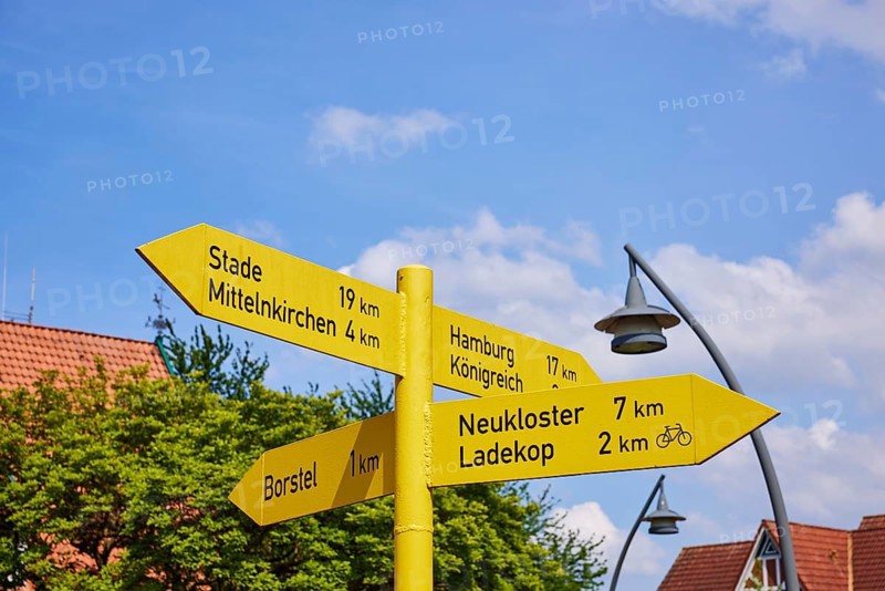 Signposts to Stade, Mittelkirchen, Borstel, Neukloster and Ladekop in the centre of Jork, Altes Land, district of Stade, Lower Saxony, Germany, Europe