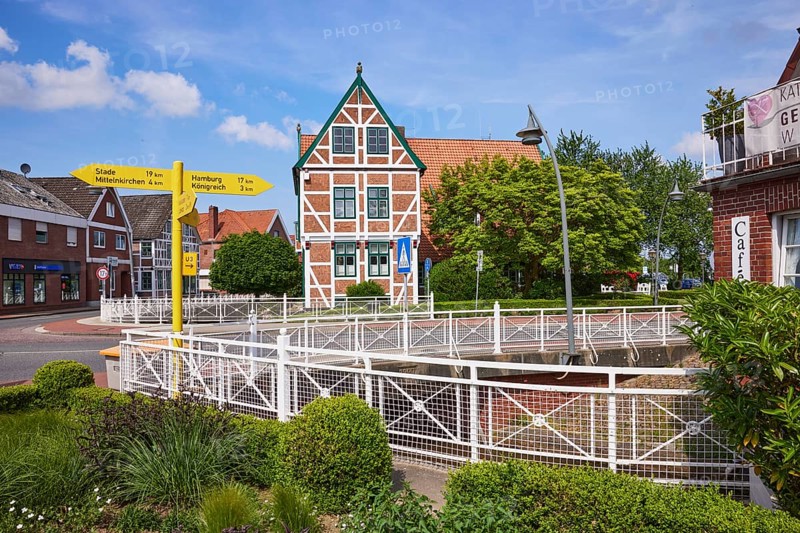 Town hall, signpost and flower bed in Jork, Altes Land, district of Stade, Lower Saxony, Germany, Europe