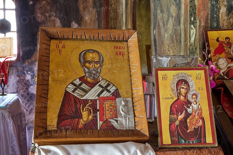 Two Christian icons in an old church setting. The pictures show saints in traditional orthodox painting, Agios Nikolaos, Madonna Odigitria, Byzantine chapel Agios Nikolaos Foundoukli, between Eleousa and Profitis Ilias, Rhodes, Dodecanese, Greek Islands, Greece, Europe