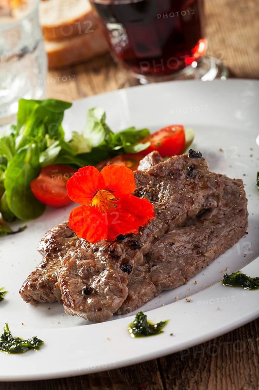 Grilled steak with nasturtium