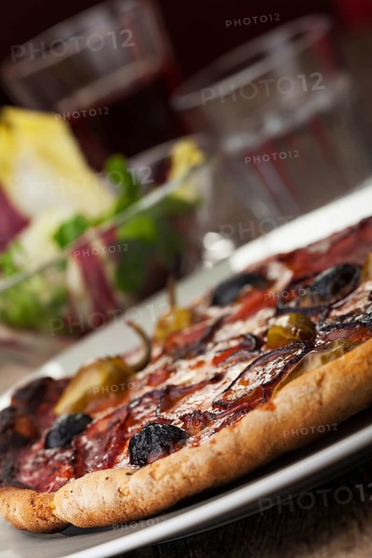 Pizza with ham and olives