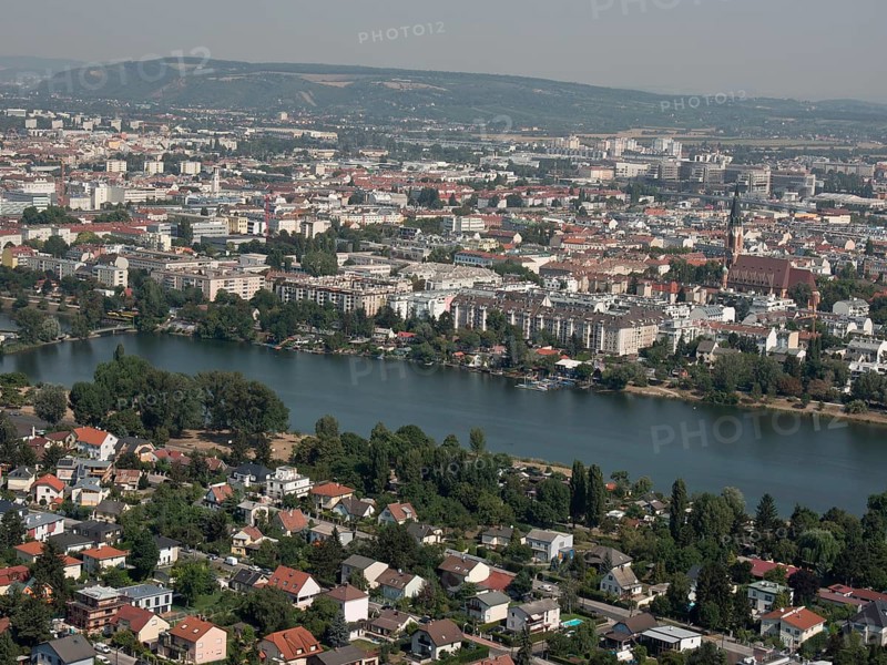 View of a city with many houses and a river, surrounded by hills, Vienna, Austria, Europe