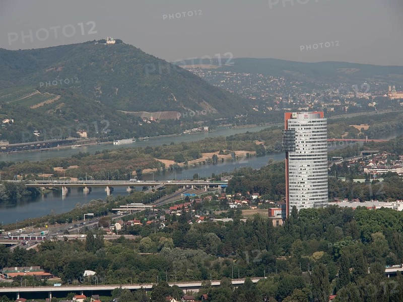 City panorama with modern skyscraper and several rivers crossing the landscape, Vienna, Austria, Europe