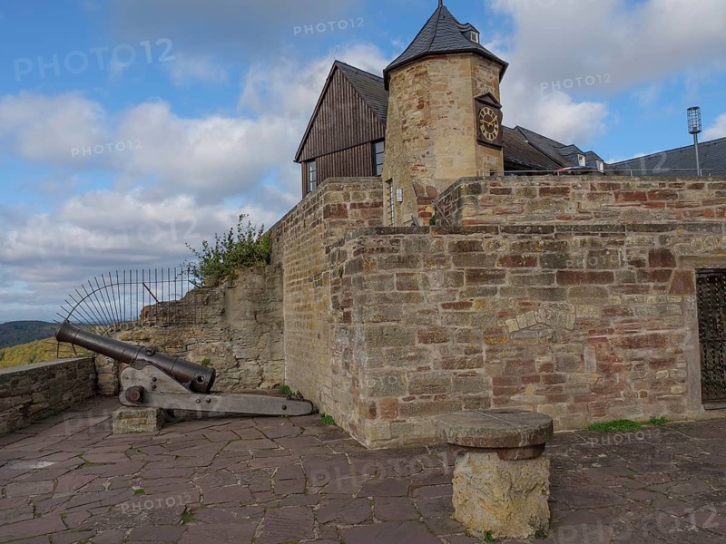 Historic castle with stone walls, a tower and a cannon under a partly cloudy sky, Waldeck, Hesse, Germany, Europe