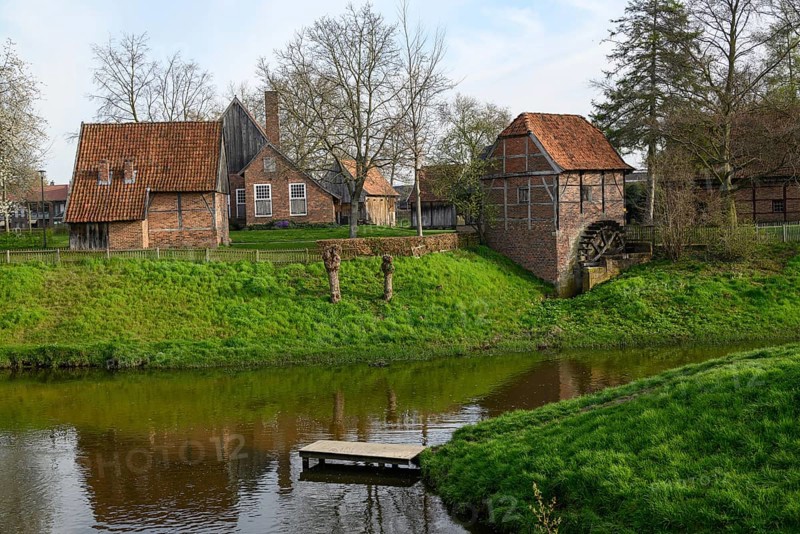 Idyllic landscape with traditional farmhouses and green lawns by a stream, Vreden, North Rhine-Westphalia, Germany, Europe