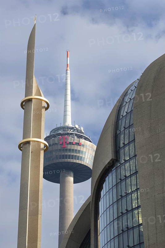 Minaret of the DITIB central mosque in Cologne Ehrenfeld, behind it the television tower, Cologne, North Rhine-Westphalia, Germany, Europe
