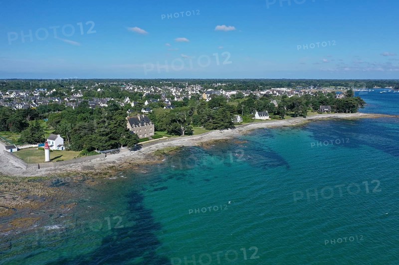 Aerial view coast of Loctudy with villas and lighthouse Phare de Langoz, department Finistere Penn ar Bed, region Bretagne Breizh, France, Europe