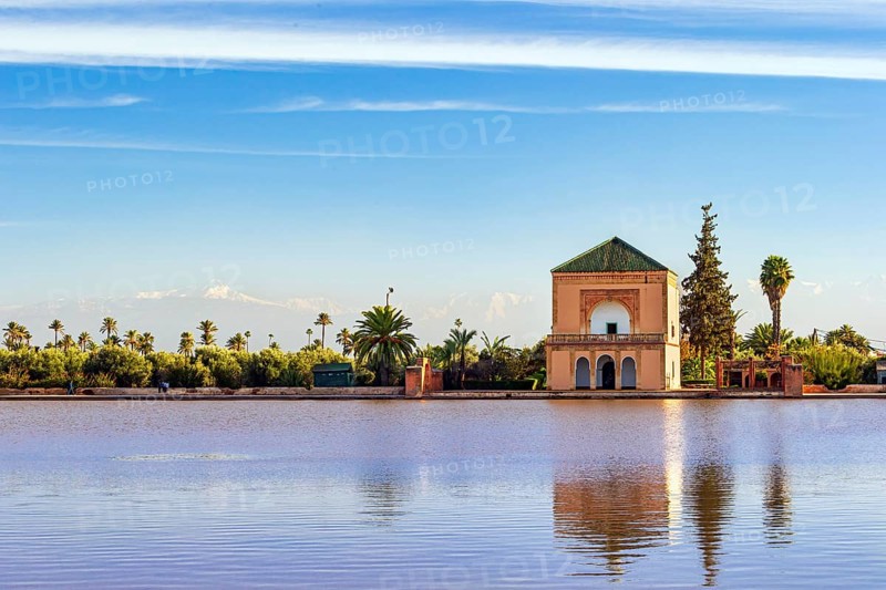 Famous Saadian pavillon reflecting in pool at Menara Gardens