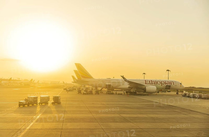 Sunset behind Ethiopian Airlines airplanes at Addis Ababa Bole International Airport ADD