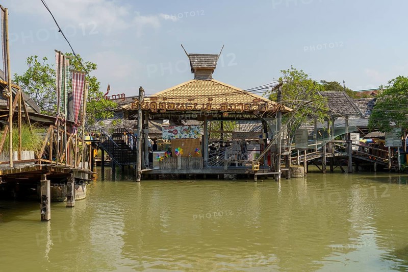 Traditional pavilion in the water on the floating market, surrounded by wooden houses and shops, Pattaya, Thailand, Asia