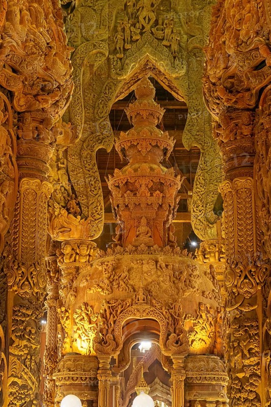 Interior view of an ornately carved wooden temple with magnificent golden elements, Pattaya, Thailand, Asia