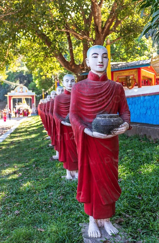 Long row of monk statues at Kaw Ka Thaung cave