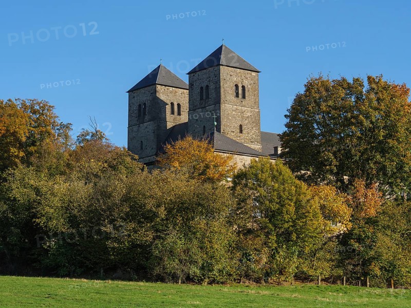 Castle with two towers, embedded in autumnal forest and illuminated by sunlight, nottuln, münsterland, germany