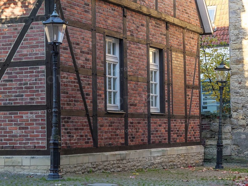 Half-timbered house with lanterns and windows in autumn, on cobblestones, nottuln, münsterland, germany