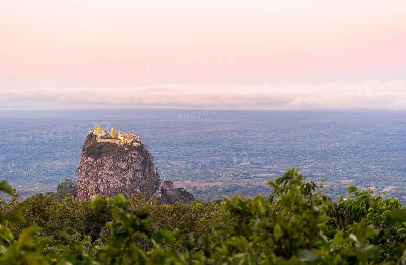 Taung Kalat Monastery seen from Mt. Popa Resort in Myanmar at dusk