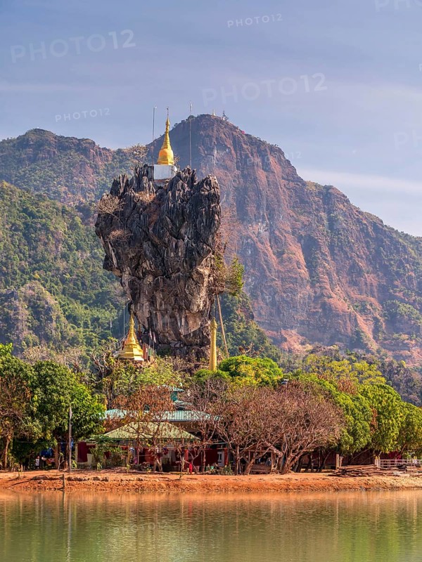 Amazing Buddhist Kyauk Kalap Pagoda under afternoon sky