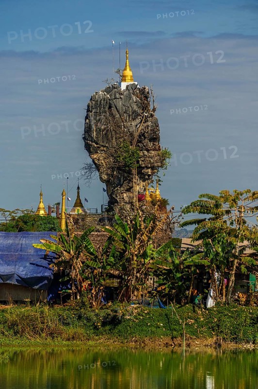 Amazing Buddhist Kyauk Kalap Pagoda under afternoon sky